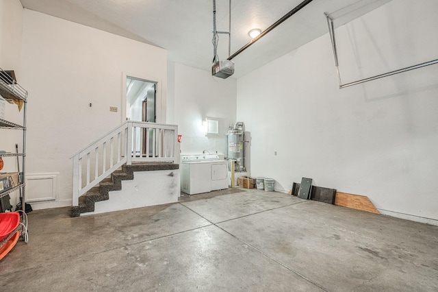 garage with washer and clothes dryer, water heater, and a garage door opener