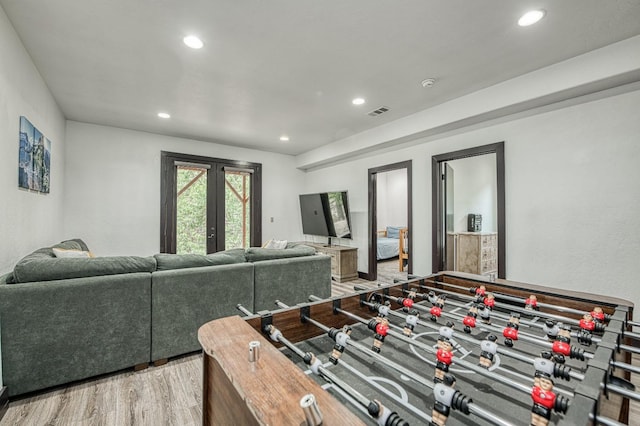 recreation room with hardwood / wood-style flooring