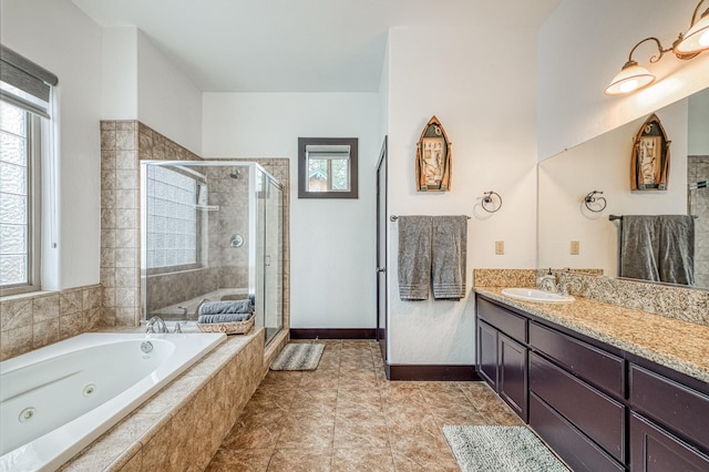 bathroom featuring shower with separate bathtub, tile patterned flooring, and vanity