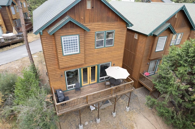 rear view of house with a wooden deck