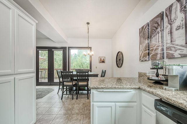 kitchen with pendant lighting, white cabinetry, dishwasher, a notable chandelier, and light stone countertops