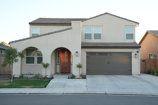 mediterranean / spanish-style house featuring a garage