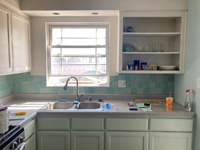 kitchen with a wealth of natural light, sink, and backsplash