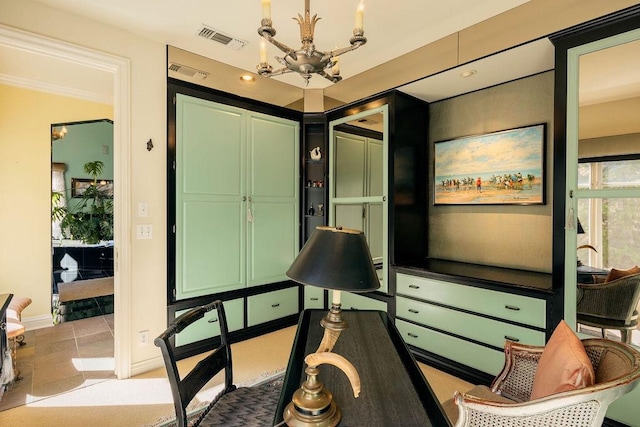 interior space featuring ornamental molding, a chandelier, and light tile patterned floors