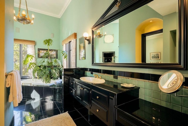 bathroom with vanity, ornamental molding, backsplash, a tub to relax in, and tile patterned flooring