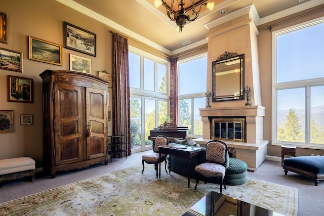 sitting room with a high ceiling, light carpet, a healthy amount of sunlight, and crown molding