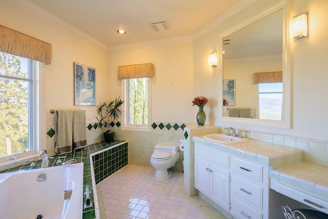 bathroom featuring a tub, vanity, tile walls, ornamental molding, and toilet