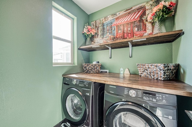 laundry room featuring washing machine and clothes dryer