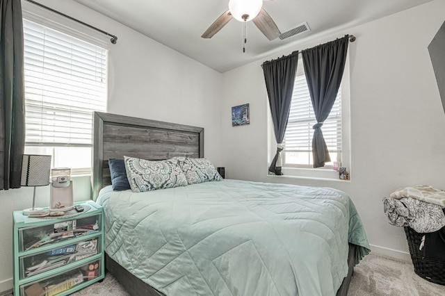 bedroom with ceiling fan and carpet