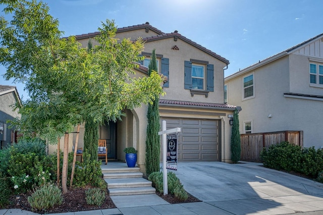 mediterranean / spanish-style home featuring a garage