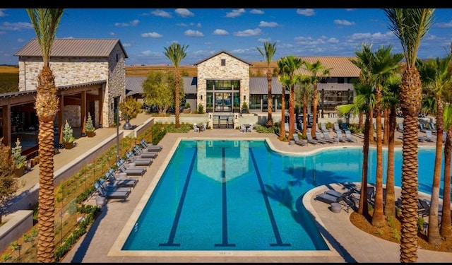 view of swimming pool featuring a patio area