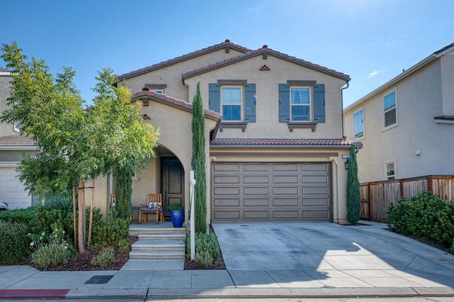 mediterranean / spanish house featuring a garage