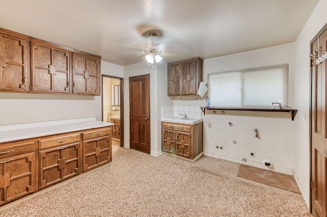 kitchen with ceiling fan and sink