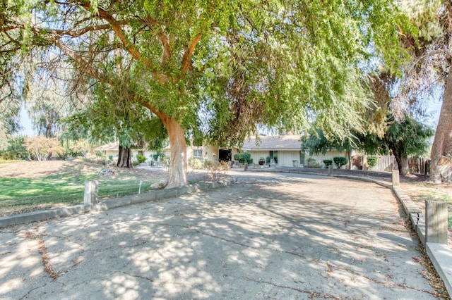 view of property hidden behind natural elements