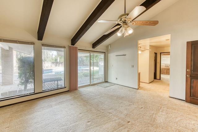 spare room featuring light carpet, vaulted ceiling with beams, and ceiling fan