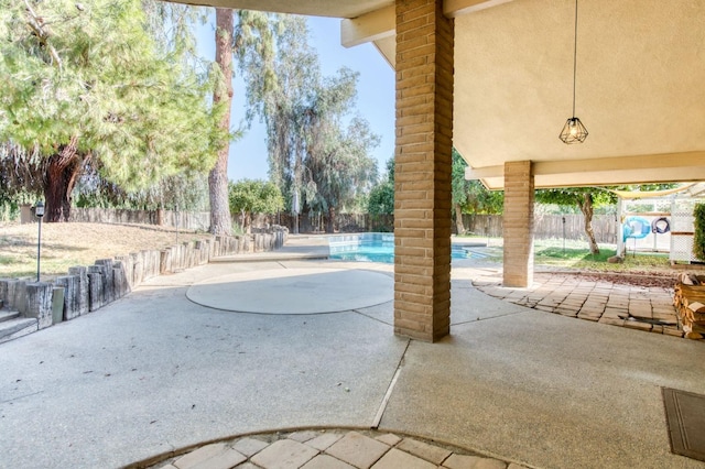 view of patio / terrace featuring a fenced in pool