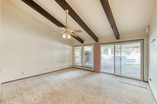 carpeted spare room featuring ceiling fan, vaulted ceiling with beams, and plenty of natural light