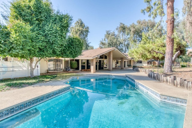 view of swimming pool featuring a patio area