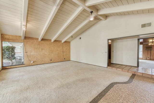 unfurnished living room featuring high vaulted ceiling, beam ceiling, and carpet floors