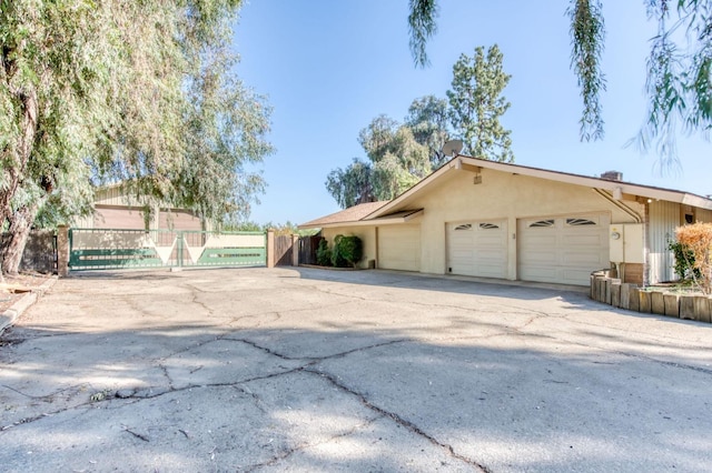 ranch-style home featuring a garage