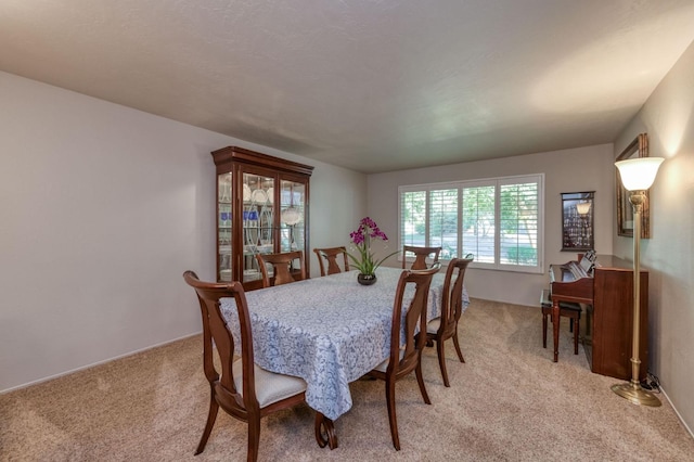 view of carpeted dining area