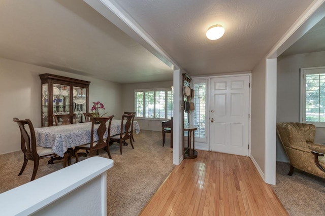 entryway featuring hardwood / wood-style flooring and a textured ceiling