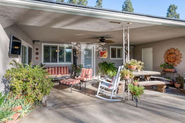 view of patio / terrace featuring ceiling fan