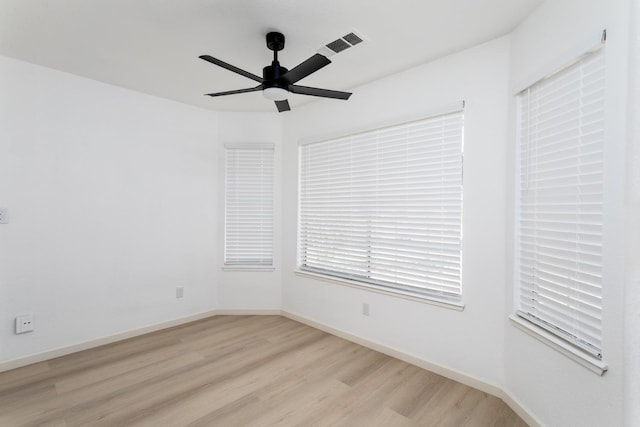 unfurnished room with light hardwood / wood-style flooring and ceiling fan