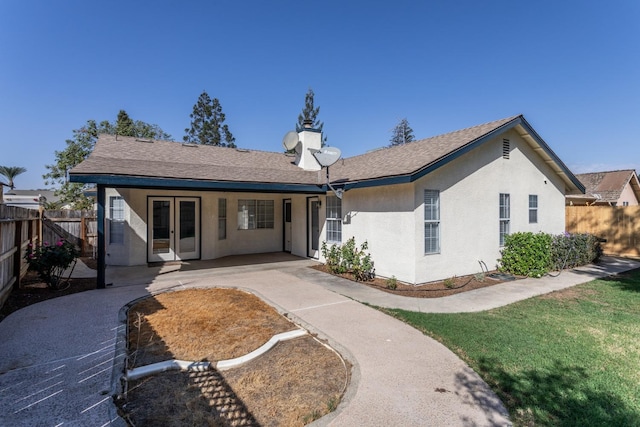 ranch-style home with a front lawn