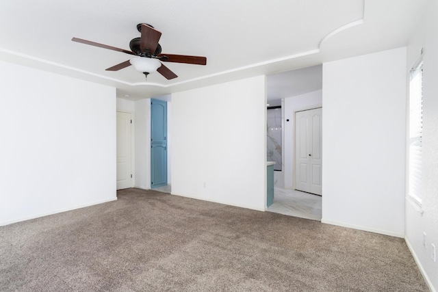 unfurnished room with light carpet and ceiling fan