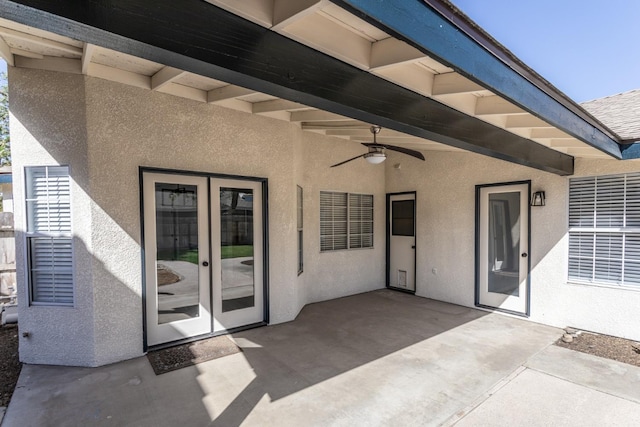 view of patio featuring ceiling fan