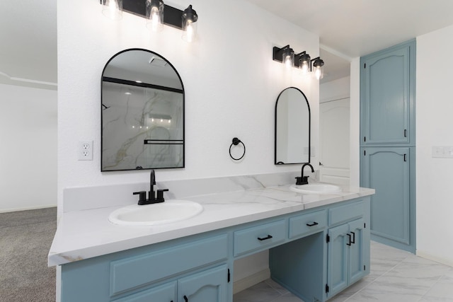 bathroom featuring vanity and a shower