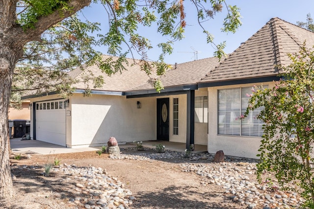 single story home featuring a garage