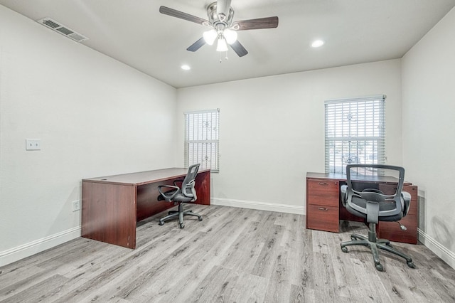 office with ceiling fan and light hardwood / wood-style floors