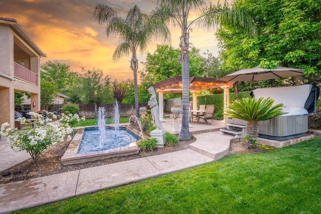 pool at dusk with a pergola, a yard, and a patio