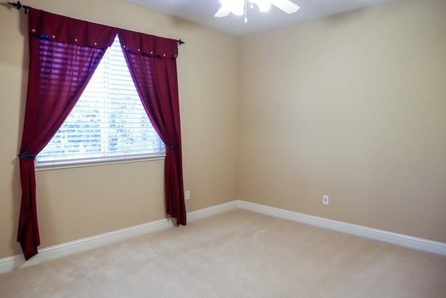 carpeted empty room with ceiling fan