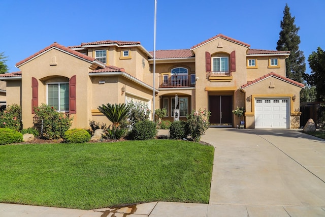 mediterranean / spanish-style home featuring a front lawn, a balcony, and a garage