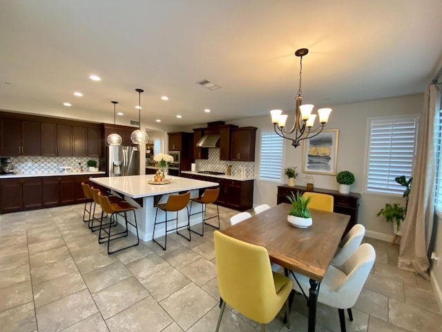 dining room with a notable chandelier