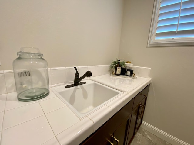 bathroom with tile patterned flooring and sink