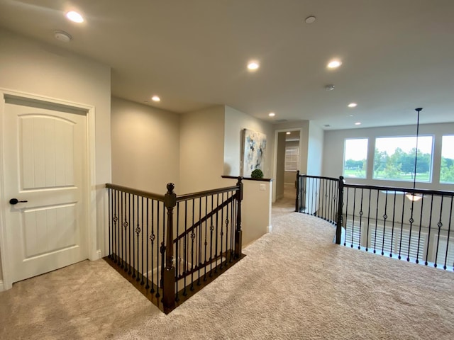 hall with carpet floors