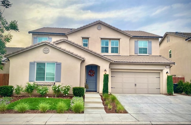 mediterranean / spanish-style house featuring a garage