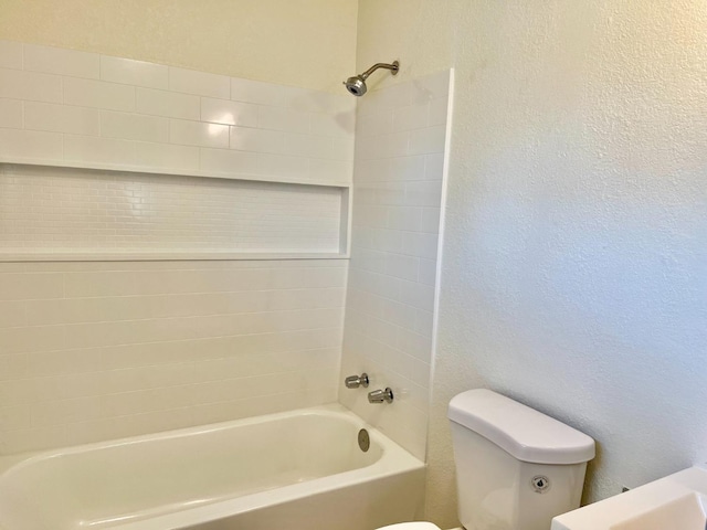 bathroom with shower / tub combination and toilet