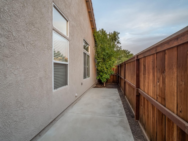 view of property exterior with a patio