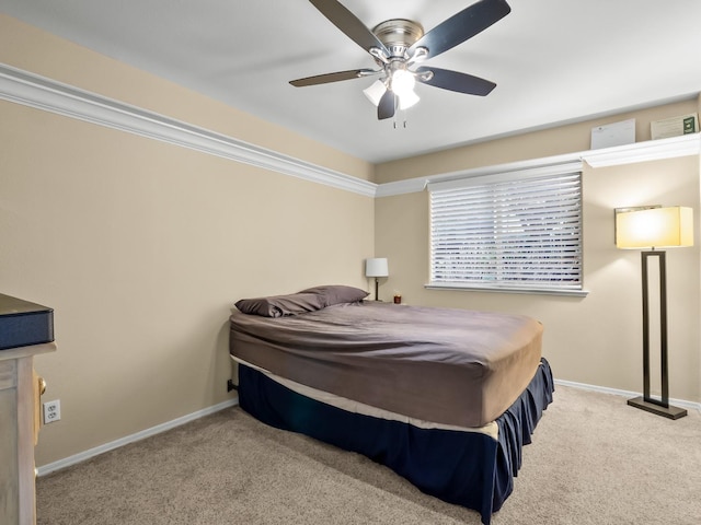 bedroom featuring ceiling fan and light carpet