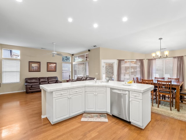 kitchen with dishwasher, light wood-type flooring, decorative light fixtures, and white cabinets