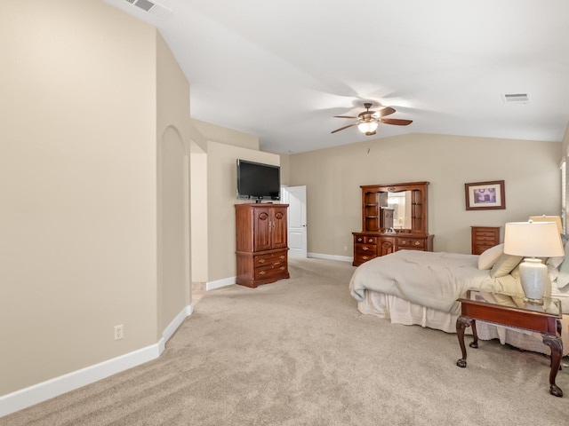 bedroom featuring lofted ceiling, light colored carpet, and ceiling fan