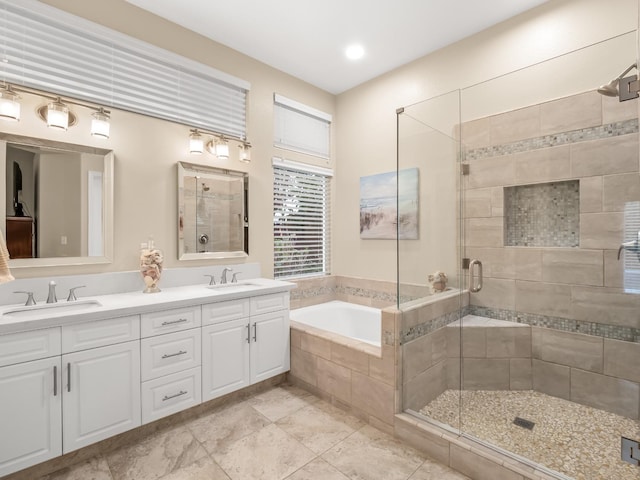 bathroom with vanity and plus walk in shower