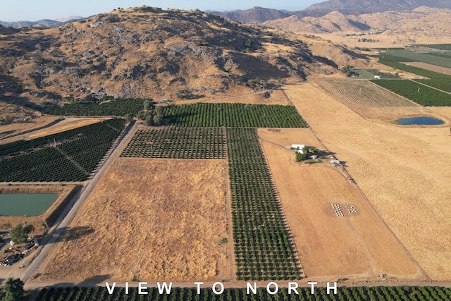 3363 S Anchor Ave, Orange Cove, CA 93646 - drone / aerial view featuring a rural view and a mountain view