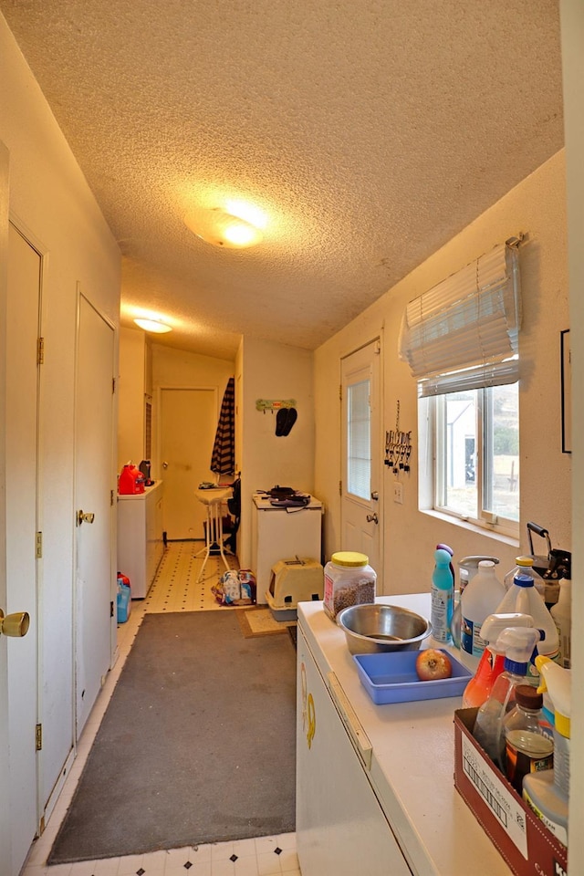 3363 S Anchor Ave, Orange Cove, CA 93646 - laundry area featuring independent washer and dryer, laundry area, and a textured ceiling