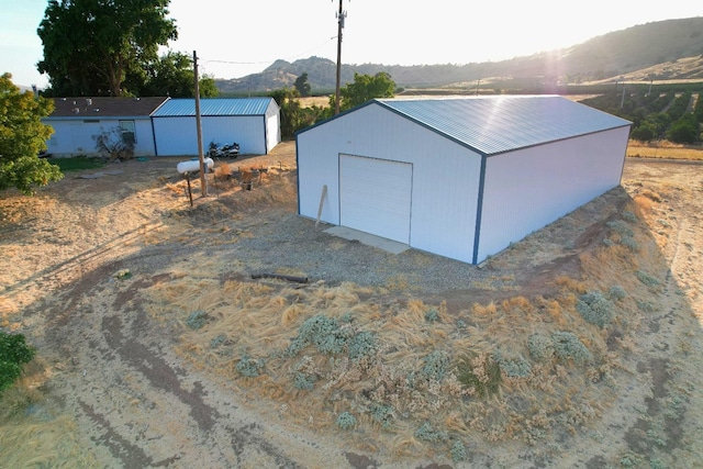 3363 S Anchor Ave, Orange Cove, CA 93646 - view of outbuilding featuring an outdoor structure and a mountain view